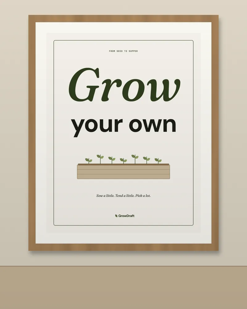 The "Grow your own" poster in an oak frame on a lime-washed wall, with a sprig of leaves below.