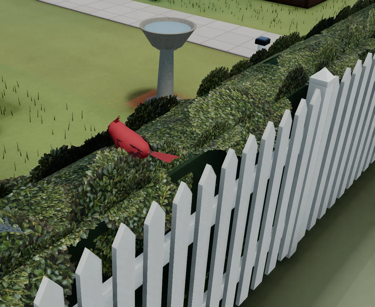 A Northern cardinal perched on the fence line beside the birdbath, staged on cue for this capture
